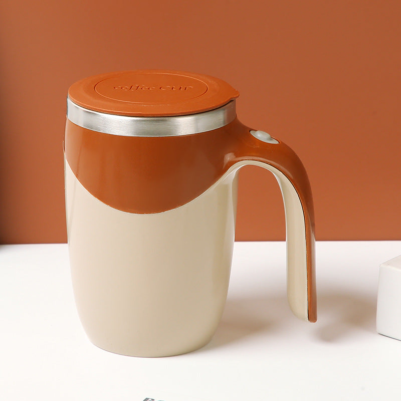 Orange and beige mug with handle on a white surface against an orange background
